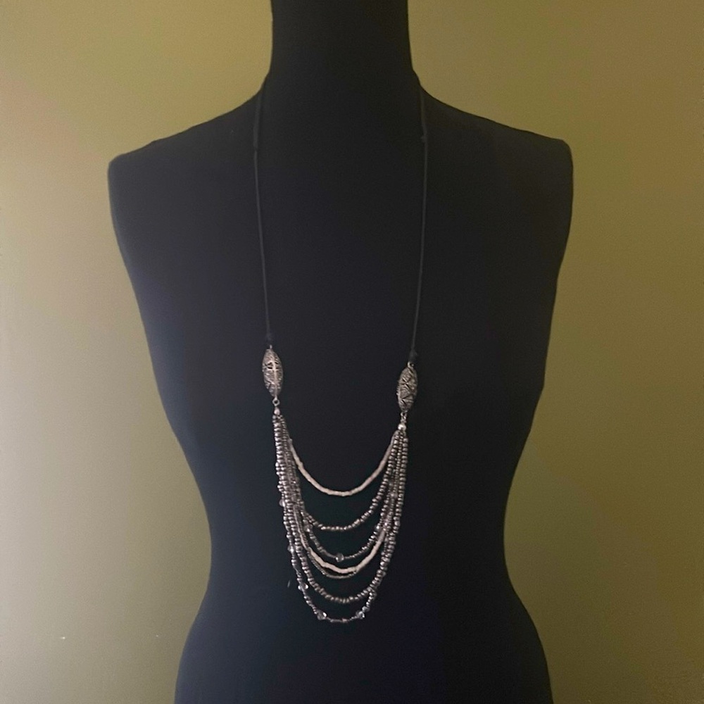 Mixed media multi strand necklace with adjustable  cord